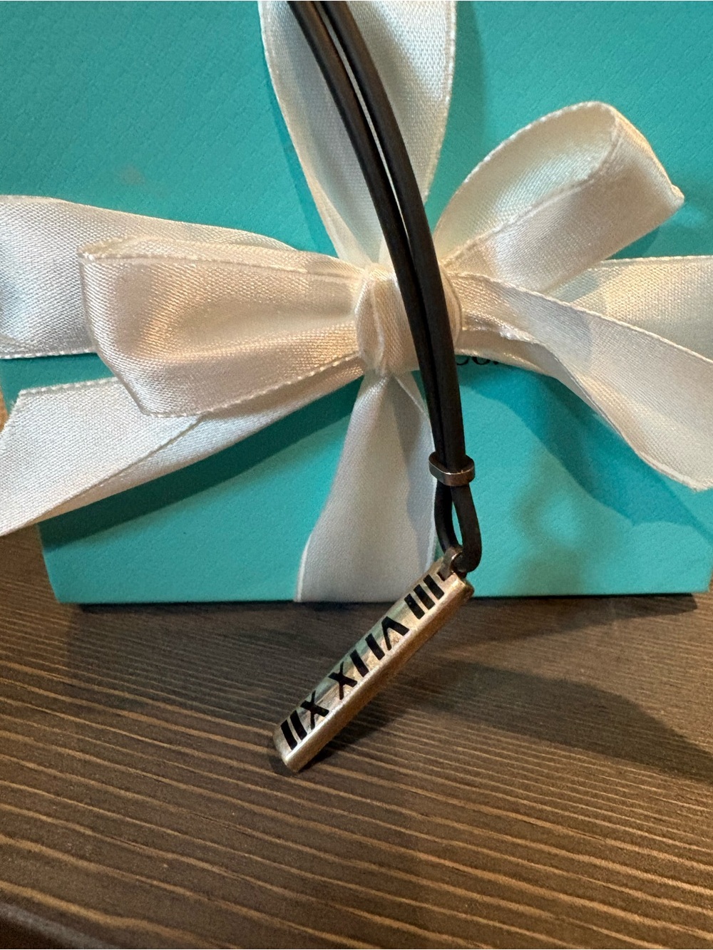 Tiffany & Co Silver Roman Numeral Bar Pendant on Black Cord - unisex